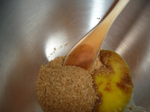 Mix melted butter with crushed weetbix