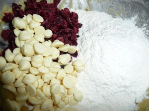 Gently mix in white choc, cranberries and flour